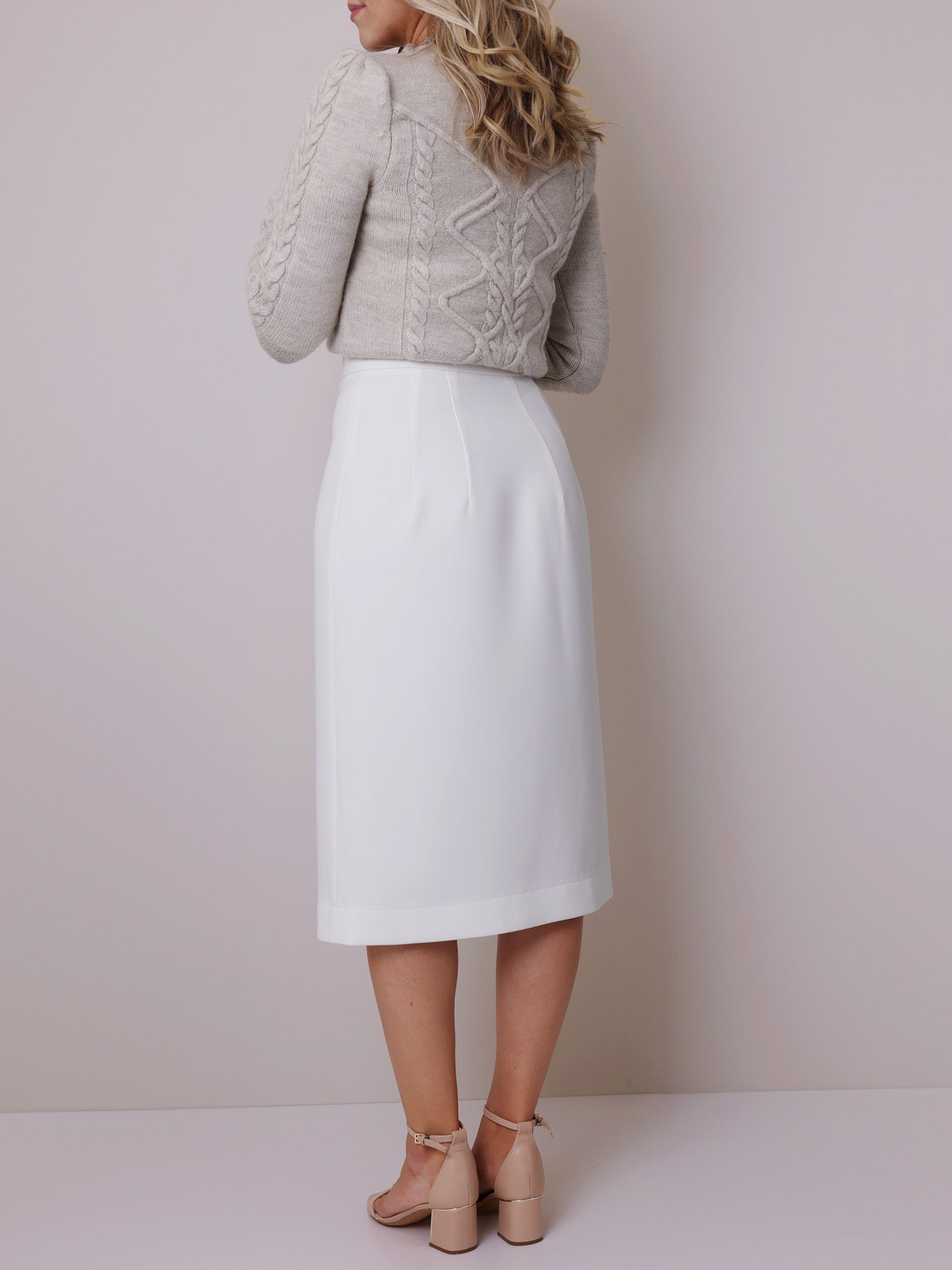 Back view of a white wrap skirt made with the midi skirt sewing pattern, highlighting the flattering fit and elegant length.